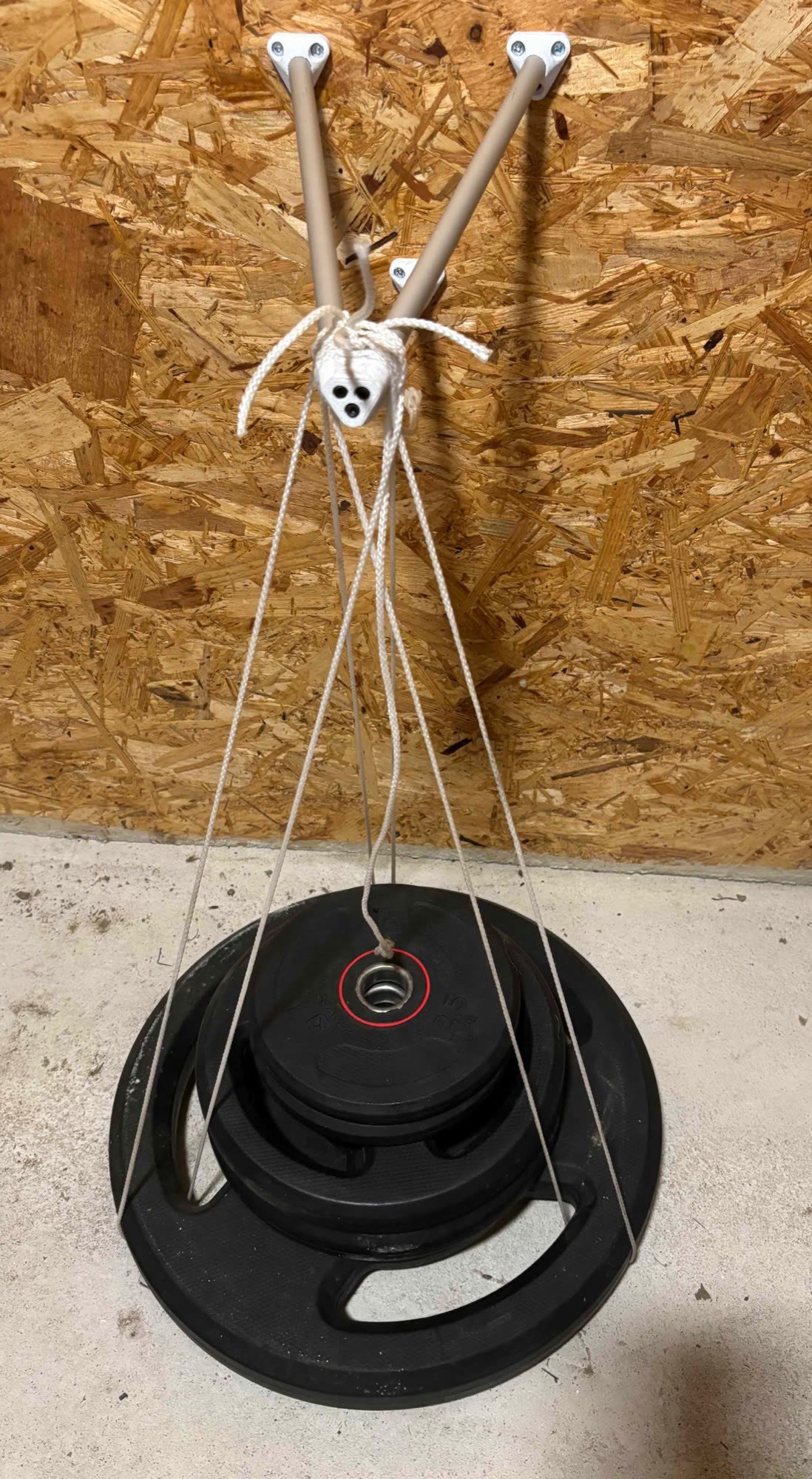 The 100 g bolted fixture supporting 35 kg on an OSB test wall