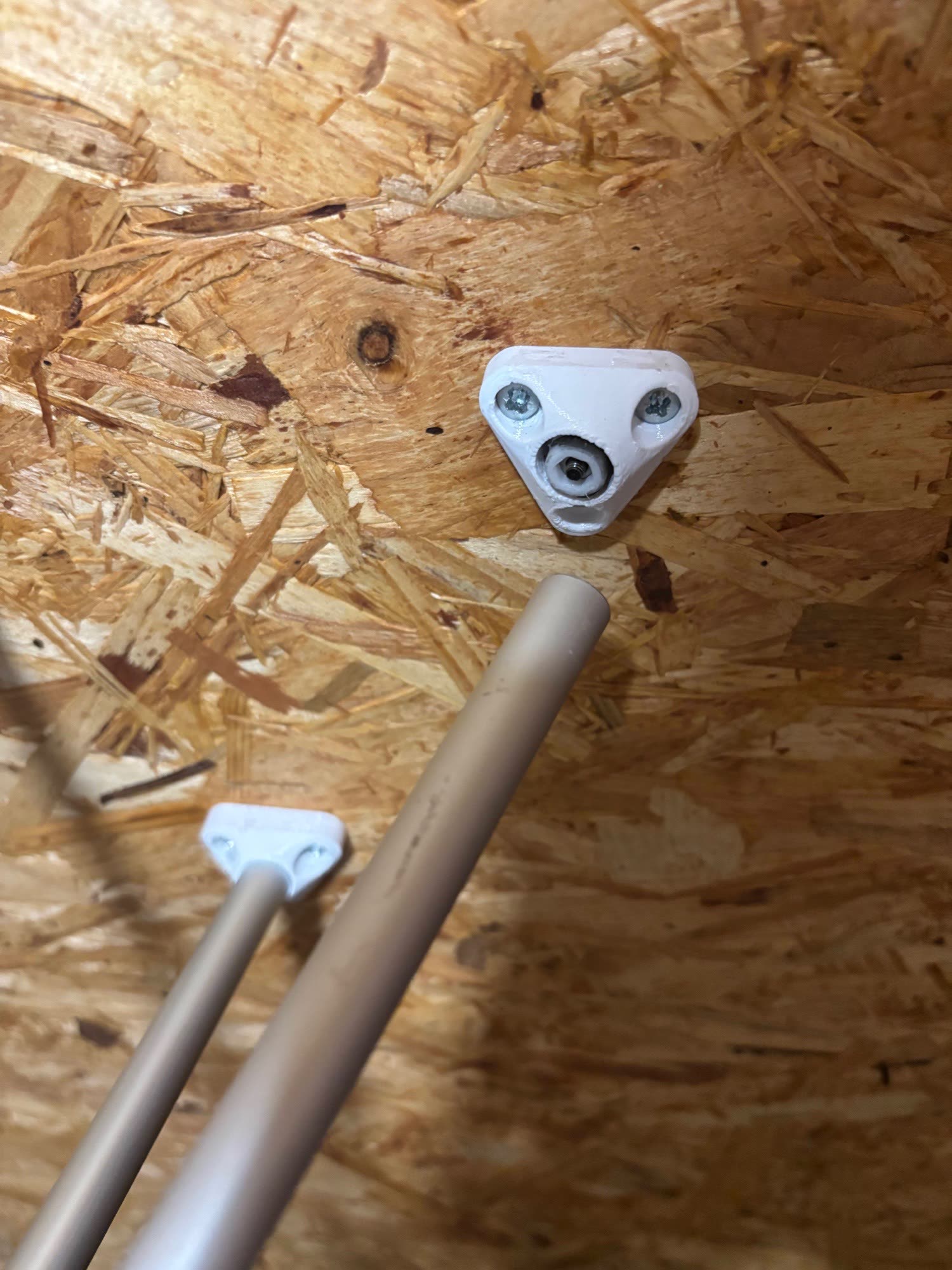 The failed connection after the 37.5 kg load step, showing the internal printed spacer and captive nut pulled out of the aluminium tube